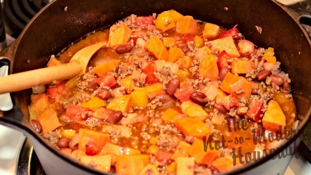 Sweet potato chili simmering in the pot. The perfect combination of savory and sweet.