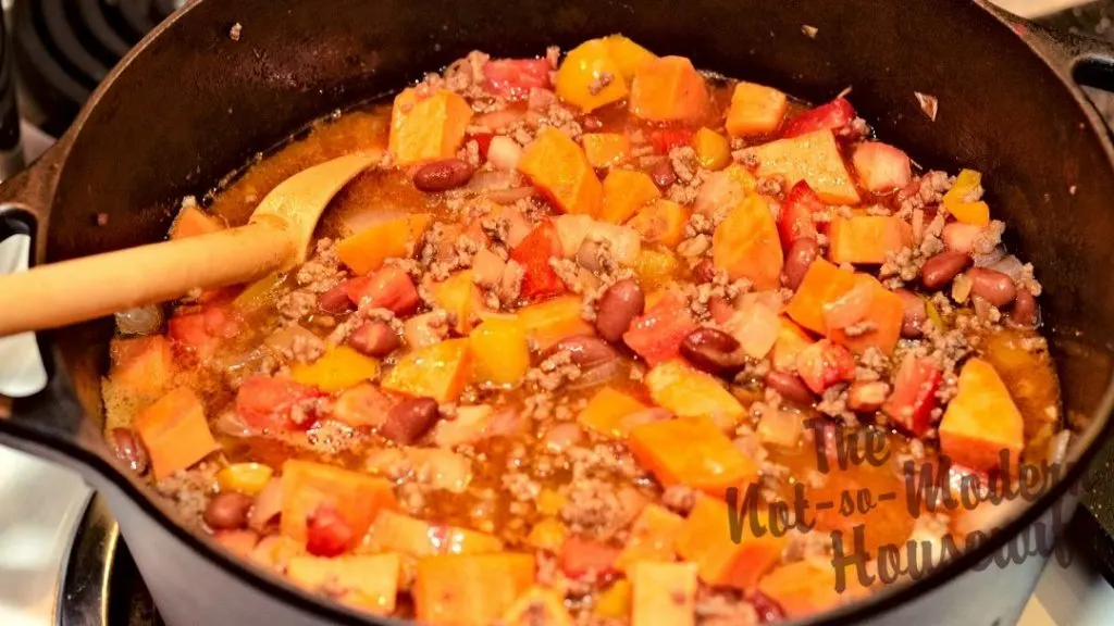 Hearty Sweet Potato Chili | The Not so Modern Housewife Sweet potato chili simmering in the pot. The perfect combination of savory and sweet.