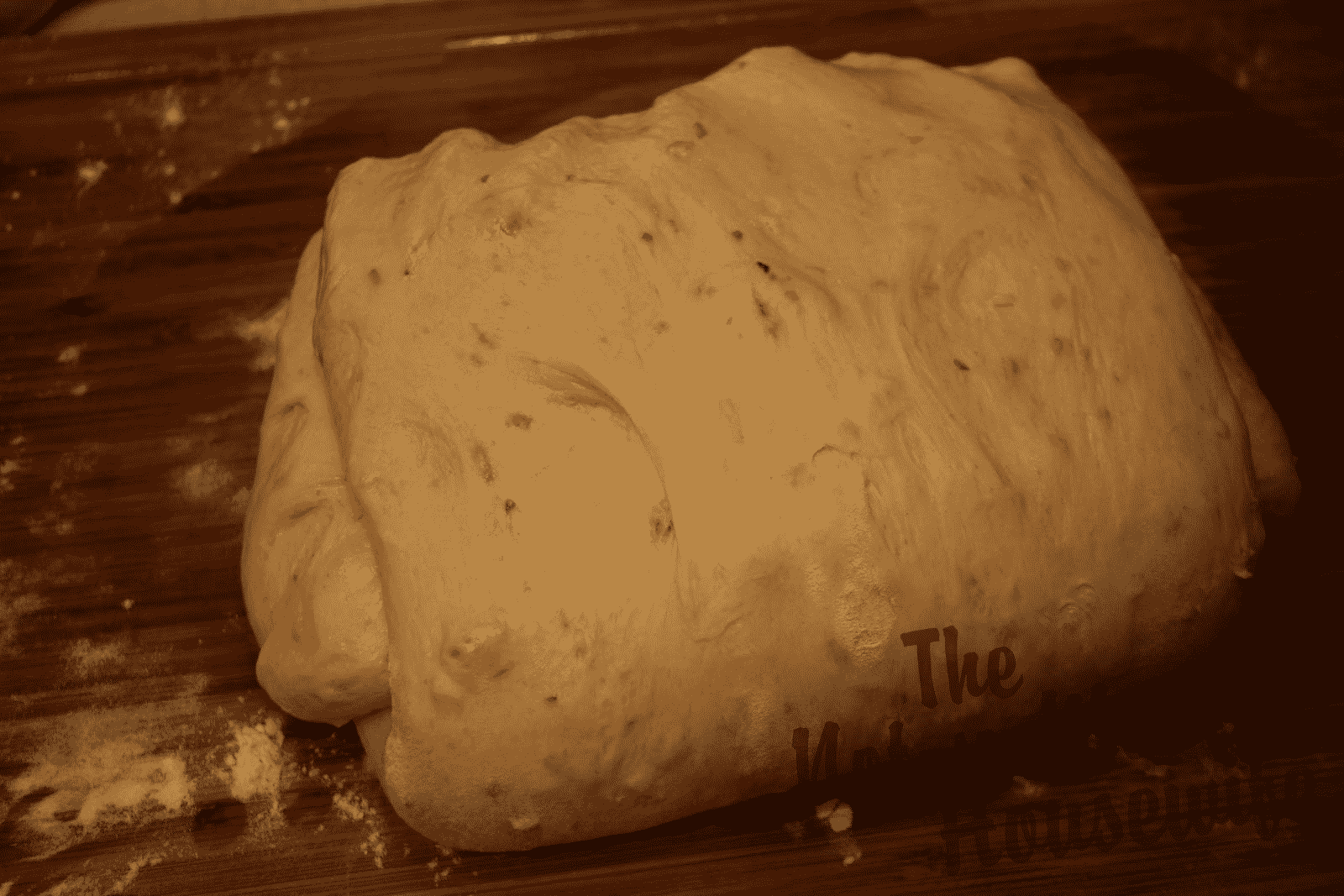 Italian Sun-dried Tomato Ciabatta | The Not So Modern Housewife folding bread dough