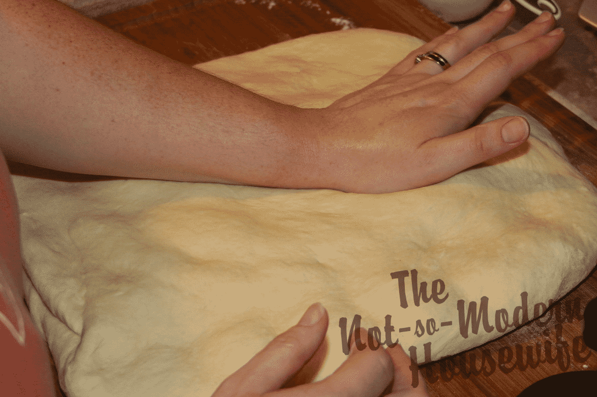 Italian Sun-dried Tomato Ciabatta | The Not So Modern Housewife shaping ciabatta bread