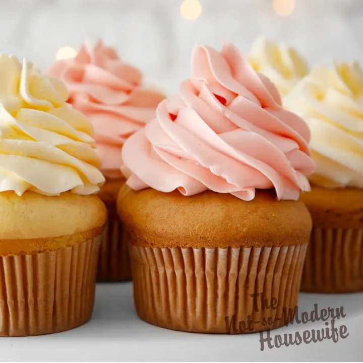 How Adding Pudding to Cake Mix Makes It Taste Better Than Homemade | The Not So Modern Housewife cream and pink decorated vanilla cupcakes - how adding pudding mix to cake mix makes it taste better than homemade
