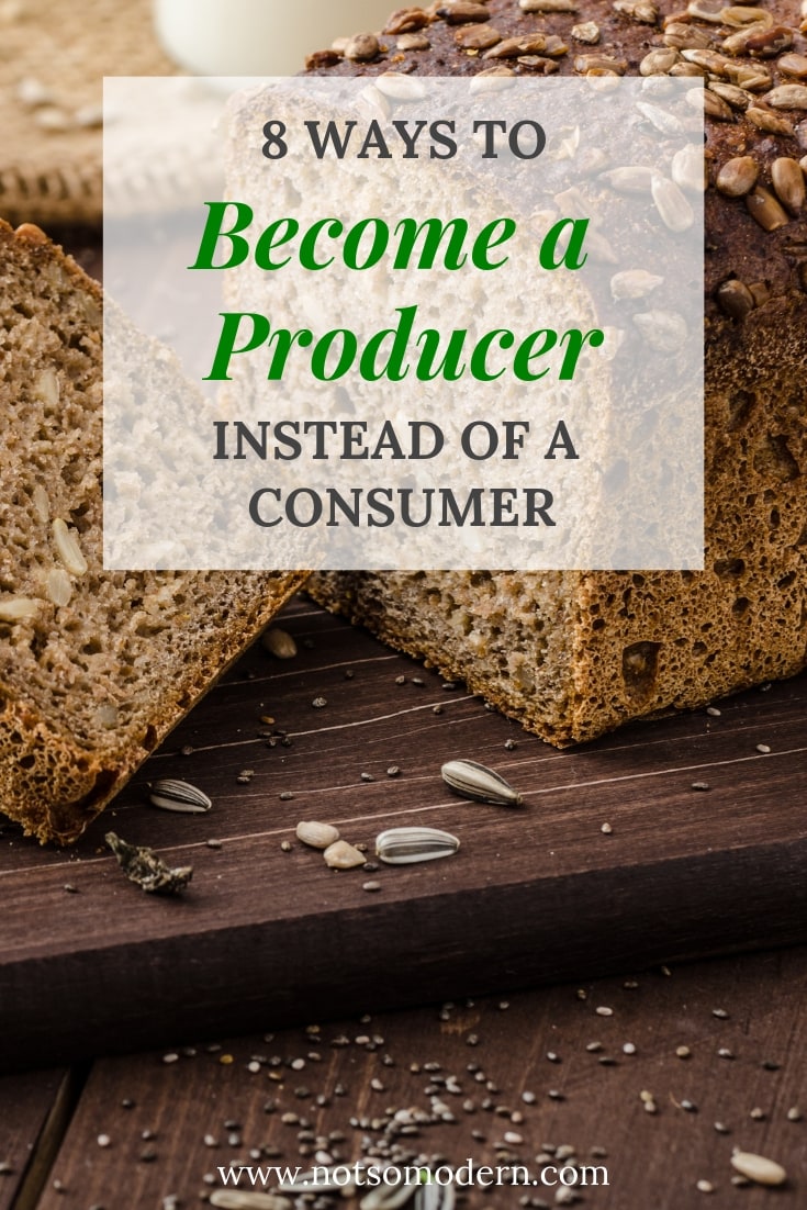 Homemade whole wheat sunflower seed bread on a wood cutting board - 8 Ways to Be a Producer Not a Consumer