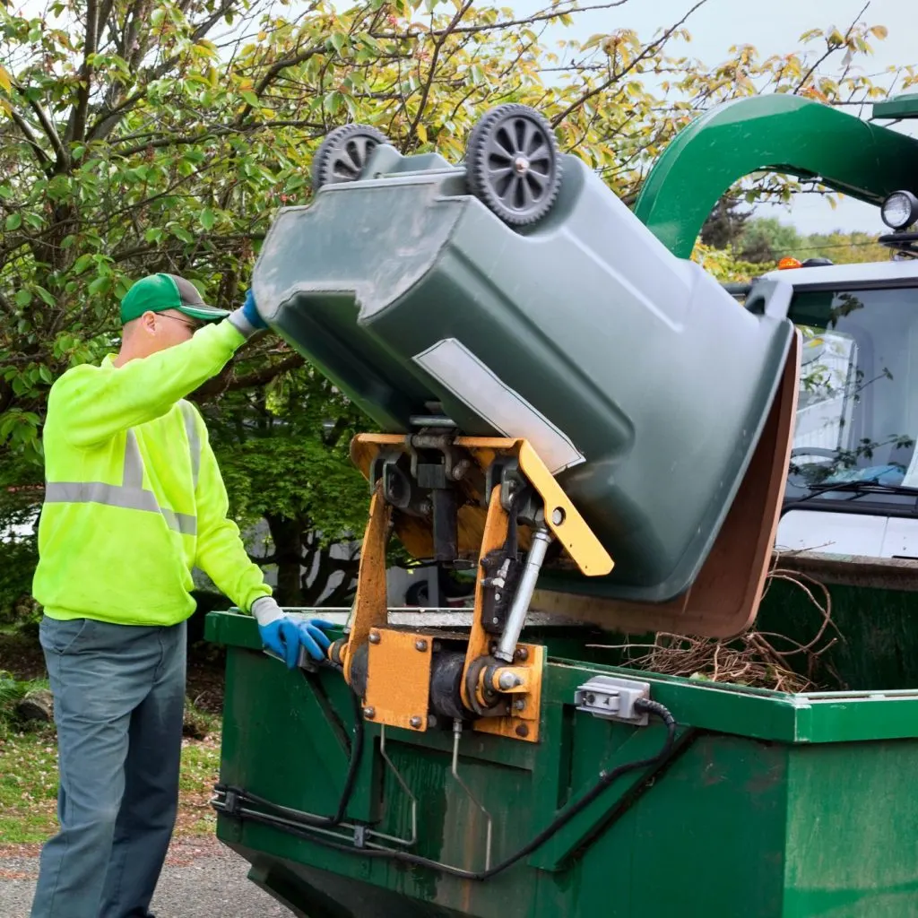 Cheap Compost: Where To Get It And What To Watch For | The Not So Modern Housewife garbage man picking up local yard waste - Cheap Compost: Where To Get It And What To Watch For