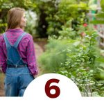 woman standing in greenhouse garden - 6 Reasons to Become Self-Sufficient