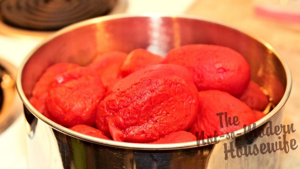 How to Can Restaurant Style Homemade Salsa | The Not So Modern Housewife Skinned tomatoes can be kept in a large bowl while they wait to be chopped before adding to homemade salsa.