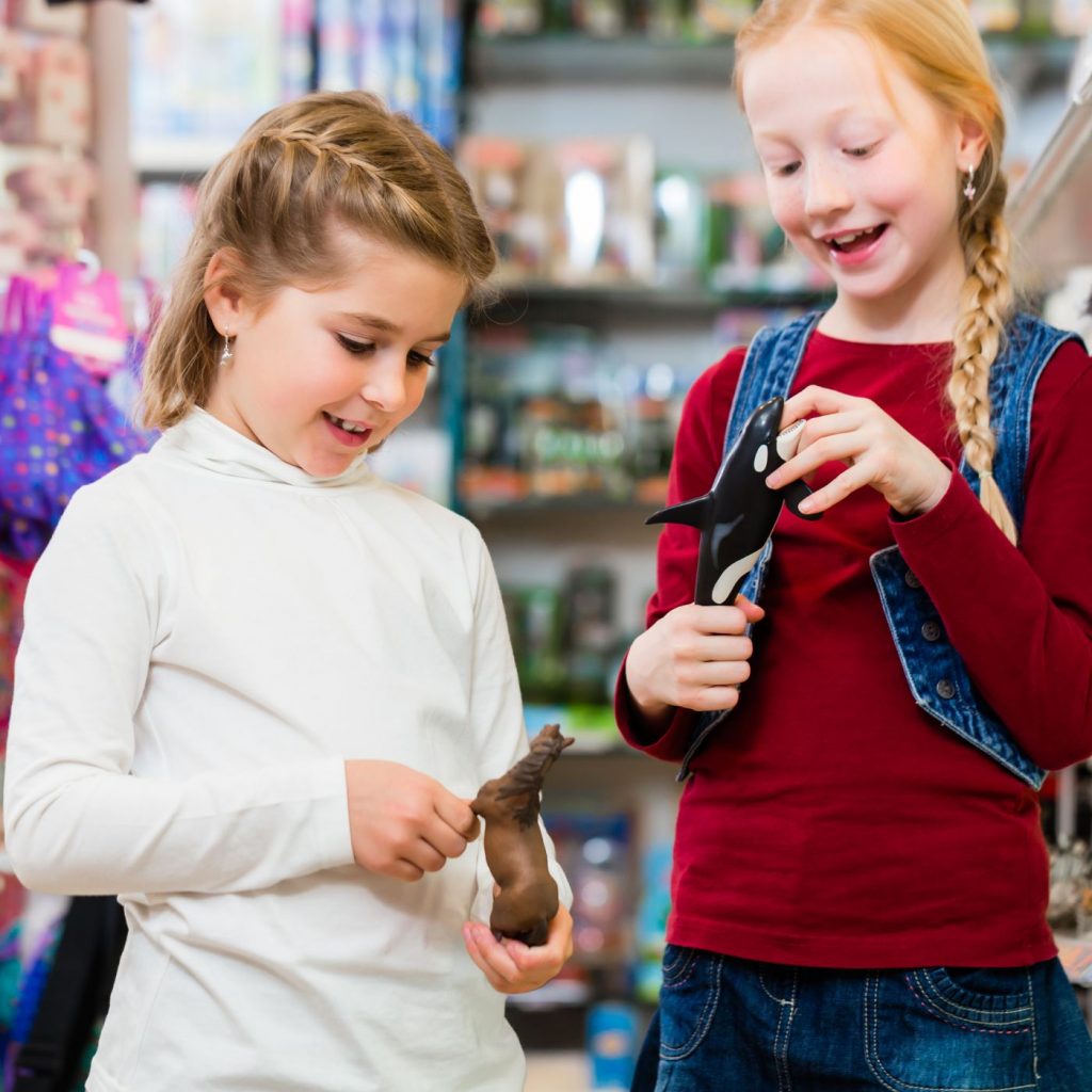 two girls shopping - making smart spending decisions