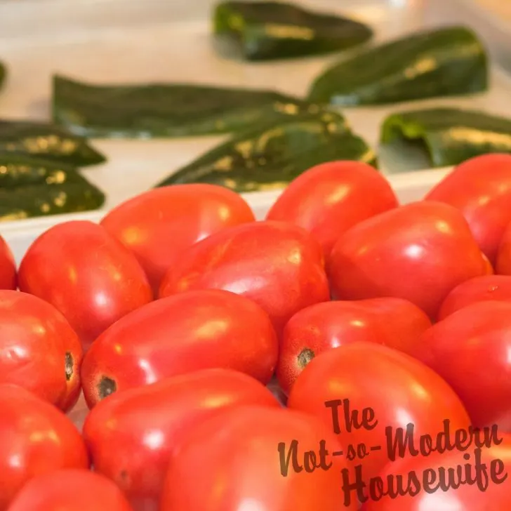 Delicious Restaurant Style Homemade Salsa Recipe with 4 Tips for Water Bath Canning | The Not So Modern Housewife fresh tomatoes and peppers on a cooking sheet - ingredients for homemade salsa