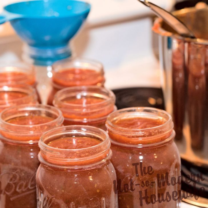 hot packing jars of homemade salsa for canning