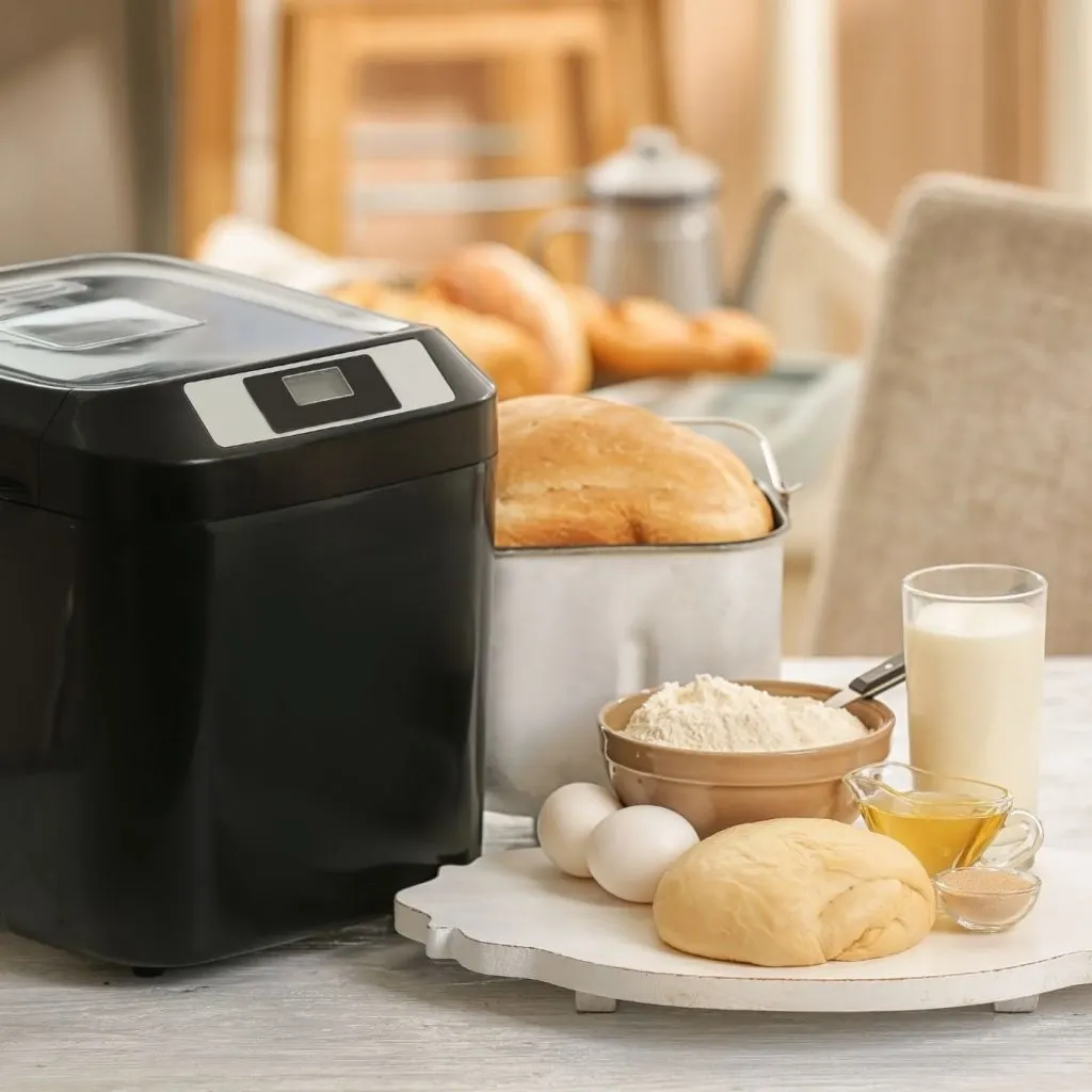 black bread maker with bread making ingredients