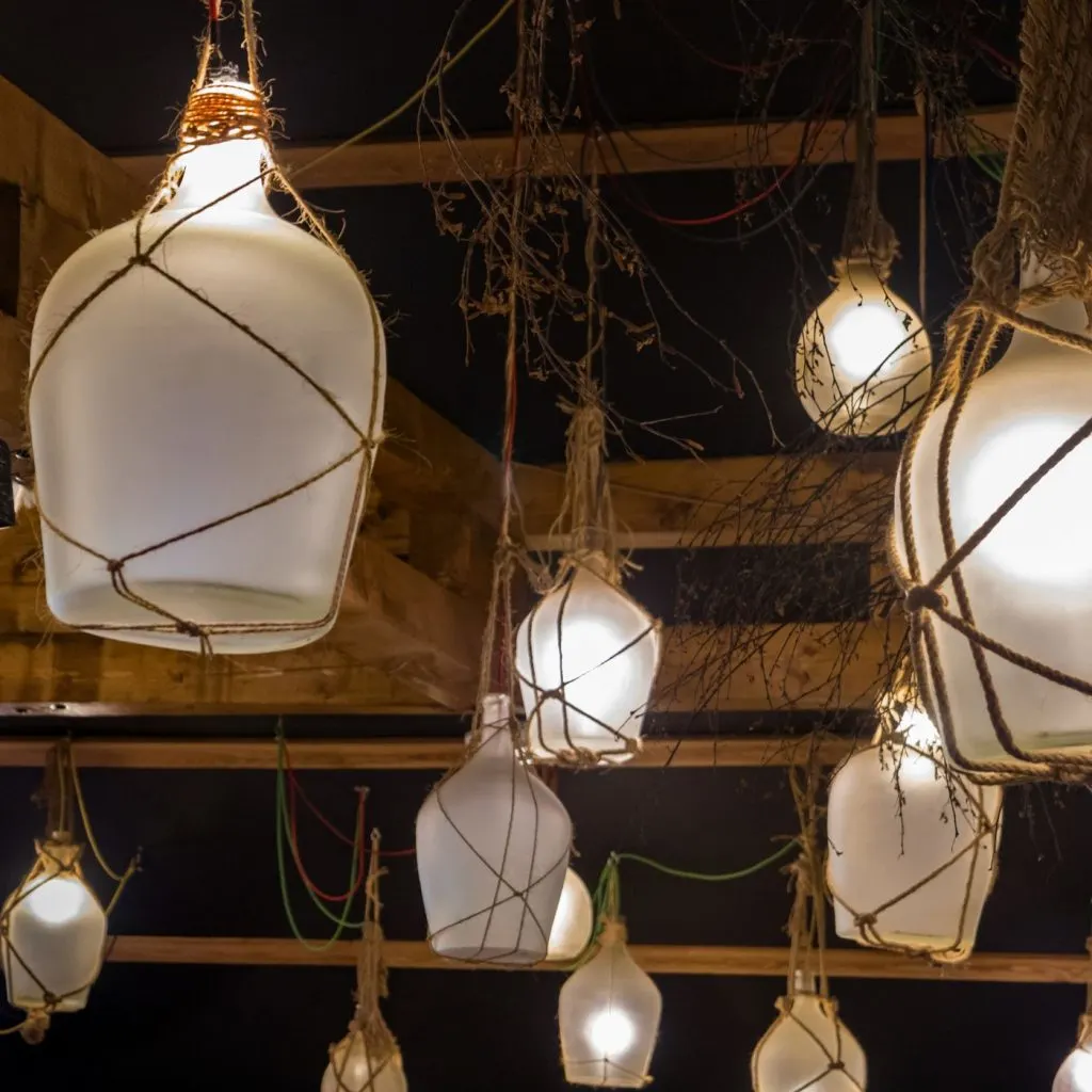 25+ Handmade Craft Ideas for Home Decor: Spruce Up Your Space with DIY Decor | The Not so Modern Housewife Glass bottle lamps - home decor handmade craft ideas