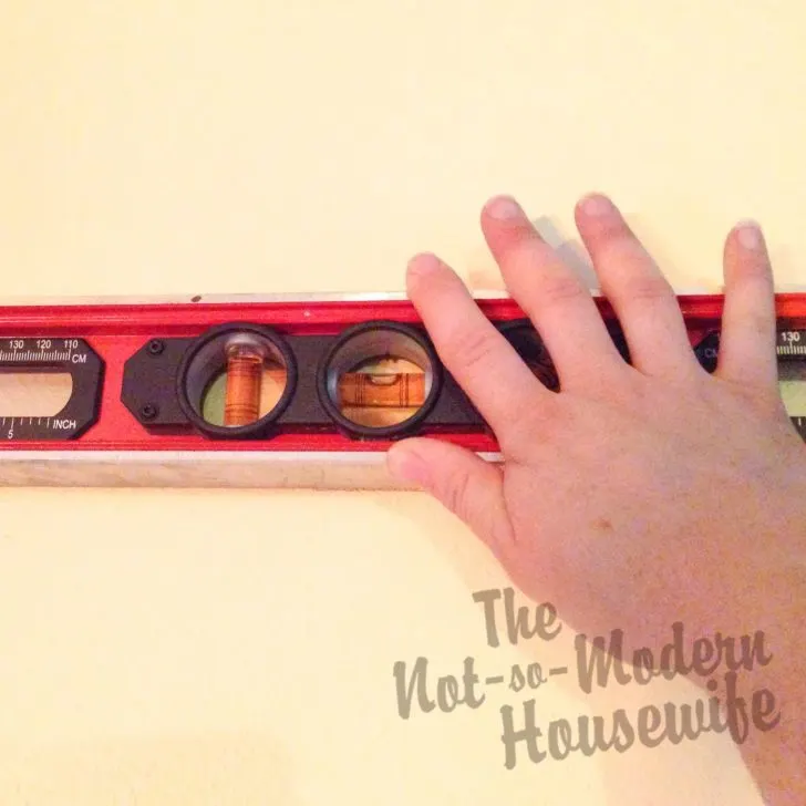 Transform Your Textured Walls with Custom Vinyl Lettering: A Step-by-Step Guide! | The Not So Modern Housewife Use level to mark walls for wall lettering