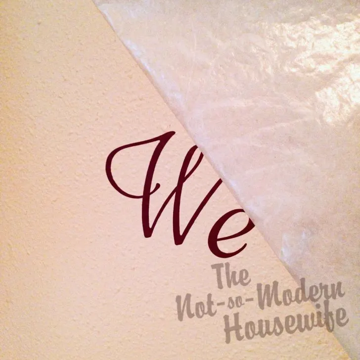 Transform Your Textured Walls with Custom Vinyl Lettering: A Step-by-Step Guide! | The Not So Modern Housewife Remove transfer paper to reveal wall lettering