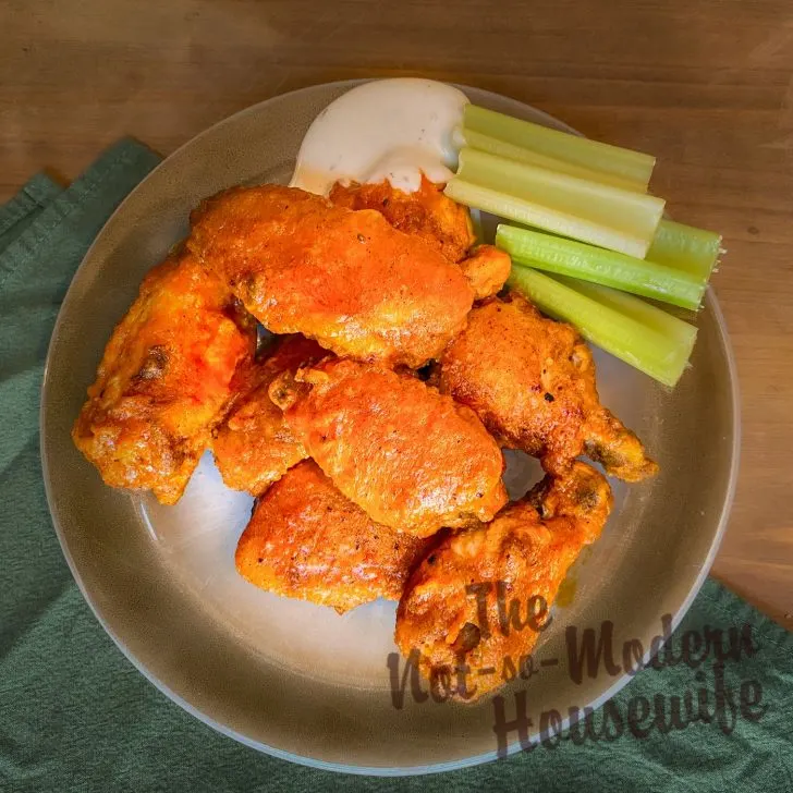 Cast Iron Chicken Wings with ranch dressing and celery sticks