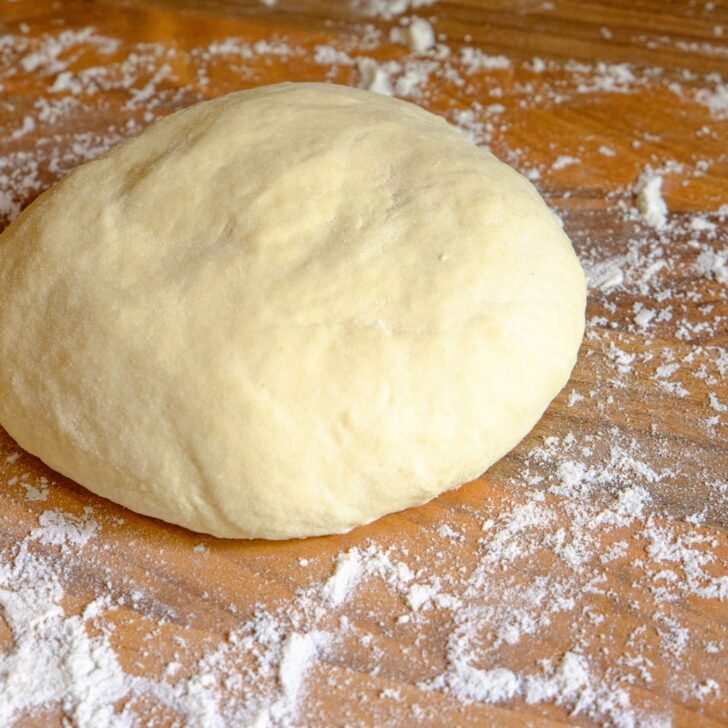 sourdough pizza dough shaped into a round